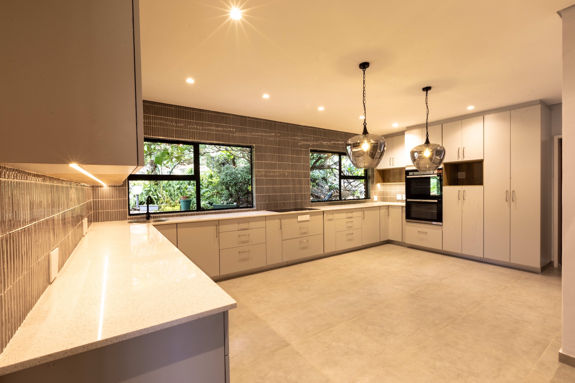 After Modern kitchen after renovation in Gauteng by MC Developments SA